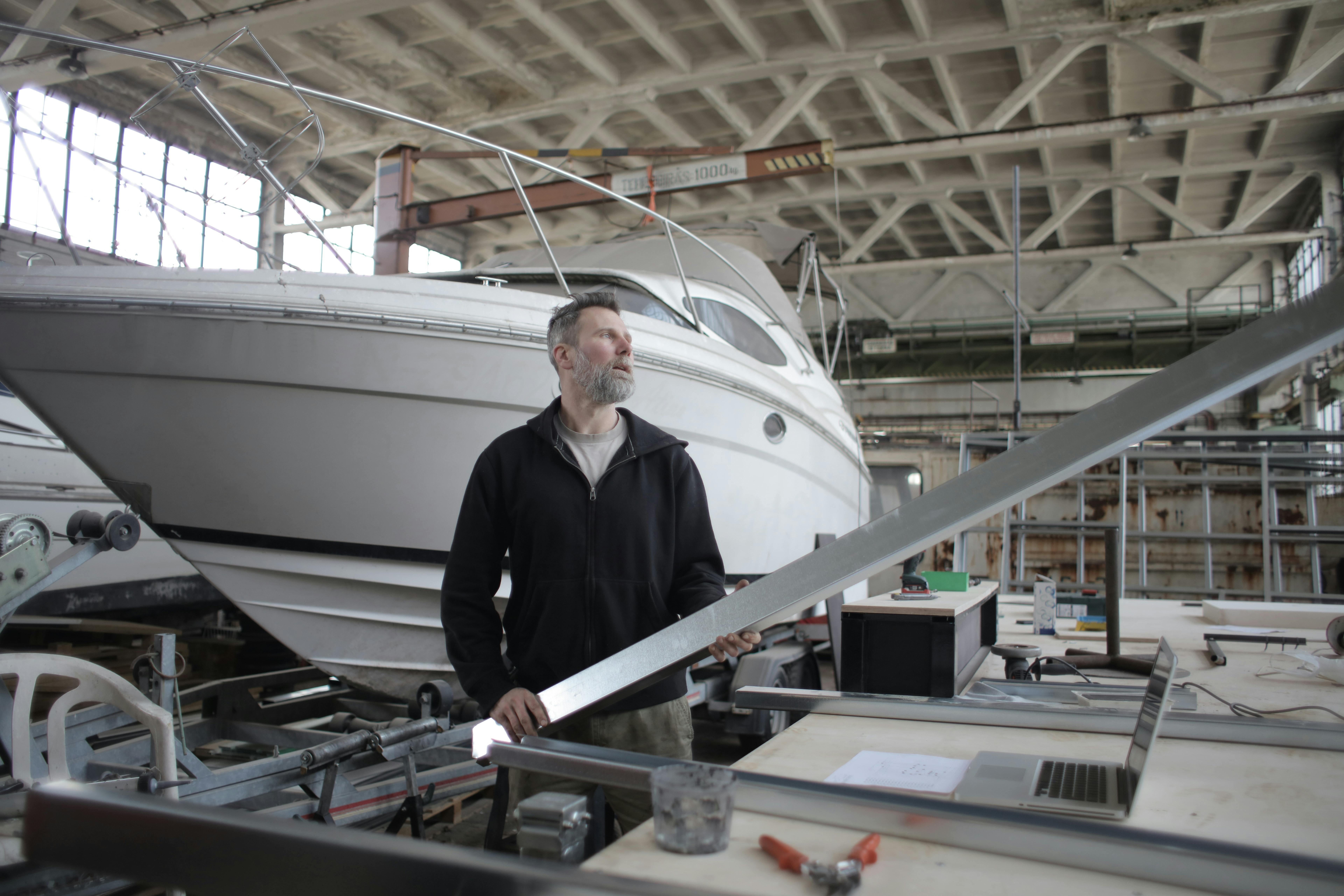 Yacht undergoing refit in a modern dry dock
